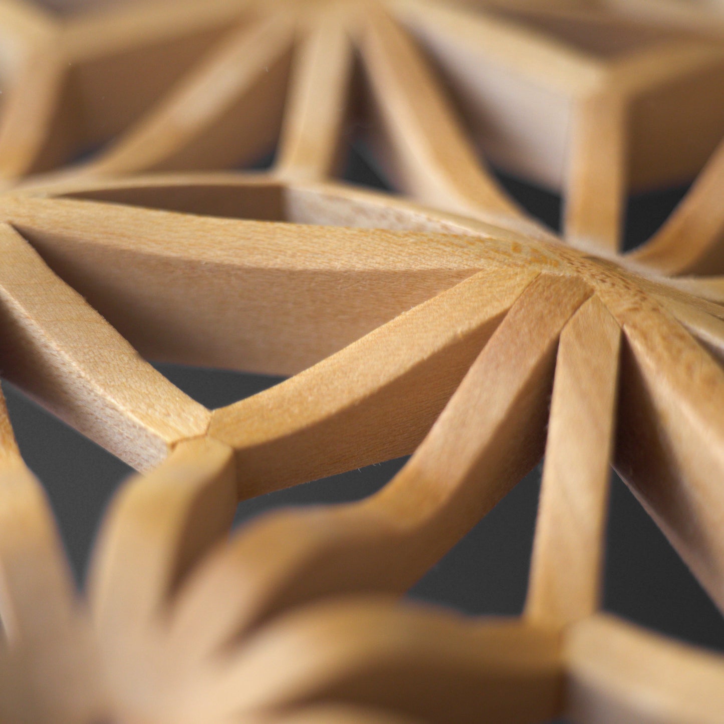 Close up photo of the 3D wavy kumiko accent of the tabletop.