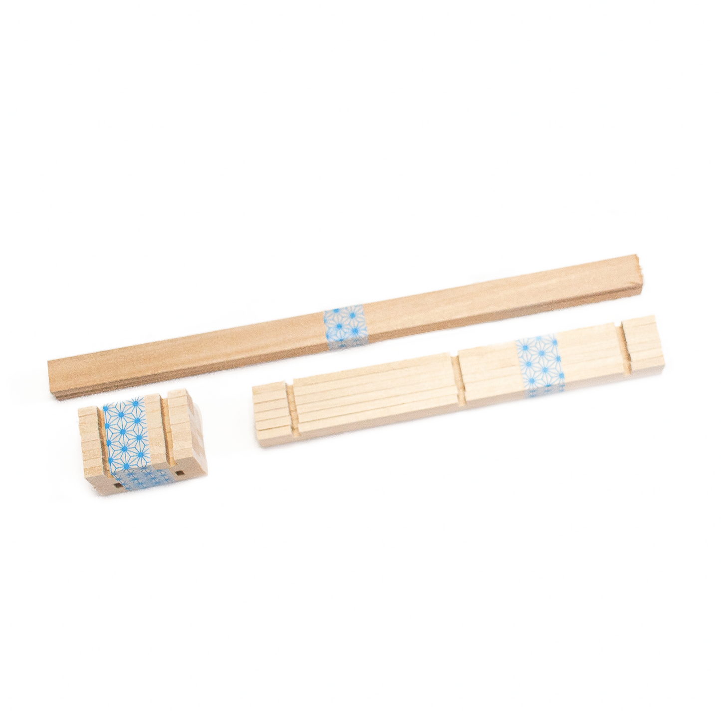 Basswood supplies wrapped in kumiko pattern washi tape.