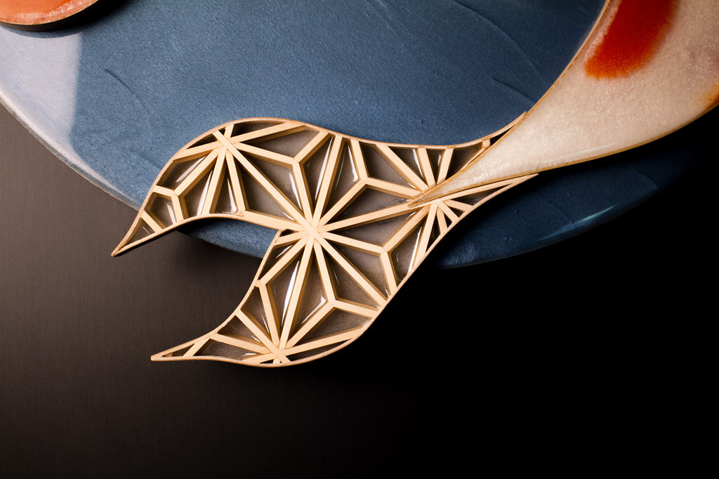 Another closeup of a tail fin, featuring an asanoha kumiko inlay with epoxy.